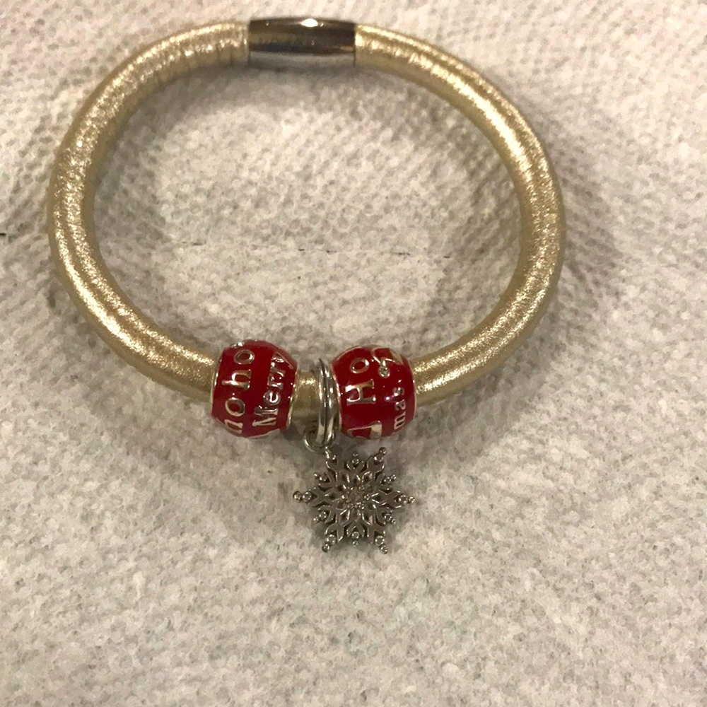 Beautiful silver Woodstock with red beads and a snowflake in the middle.